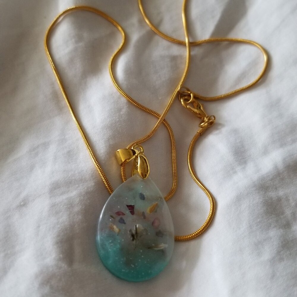 Frosted glass pendant with gold-colored chain
